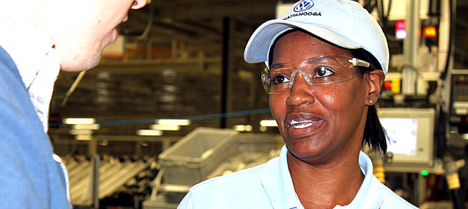 A worker at VW's Chattanooga plant answers questions from the author during a plant tour in 2011.