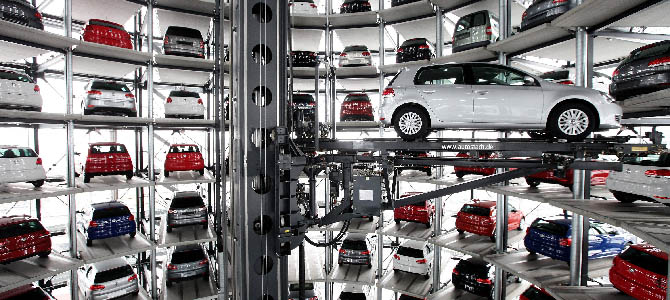 WOLFSBURG, GERMANY - MARCH 11: Cars by German automaker Volkswagen AG stand parked in one of two towers at the Autostadt customer reception center at the Volkswagen factory on the day of VW's annual press conference on March 11, 2010 in Wolfsburg, Germany. VW Chairman Martin Winterkorn admitted that VW had been affected by the worldwide financial crisis in 2009, though reported that many of VW's brands reported growth, especially in China. VW customers who come to Wolfsburg to pick up their car in person receive their new car after a robot extracts the car from one of the two towers and brings it to them via an automated, underground transport system. Each of the two towers hold 400 cars. (Photo by Sean Gallup/Getty Images)